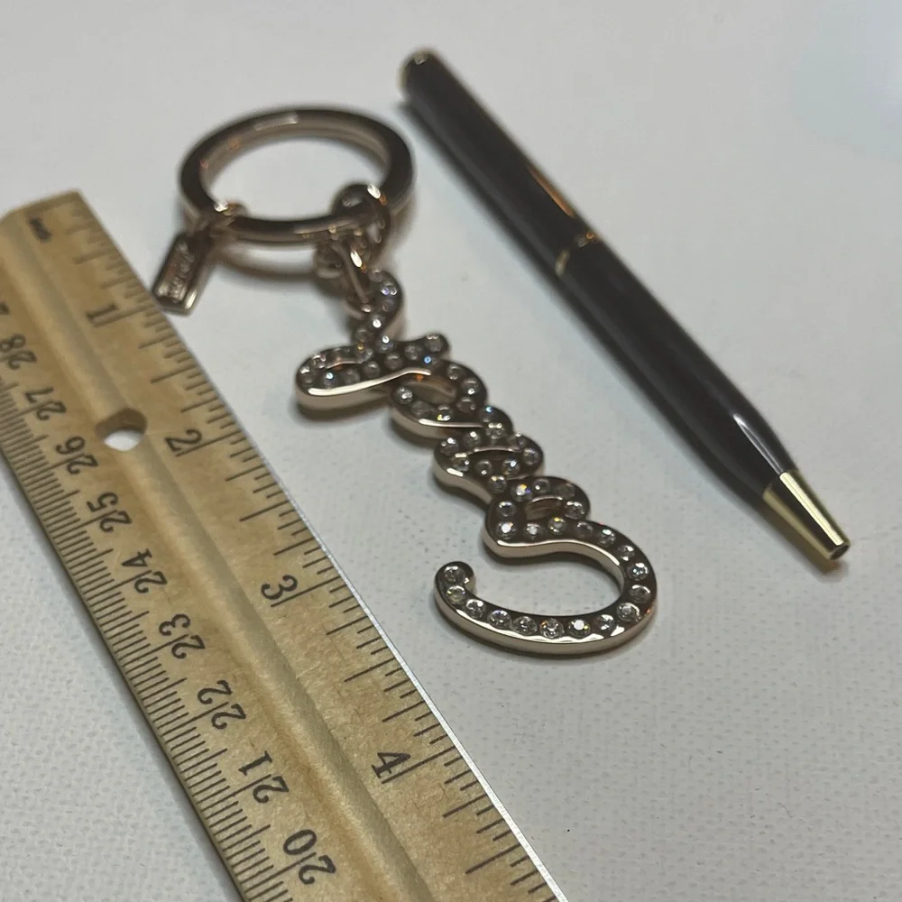 Coach Gold Rhinestone Keychain with a Black Coach Pen